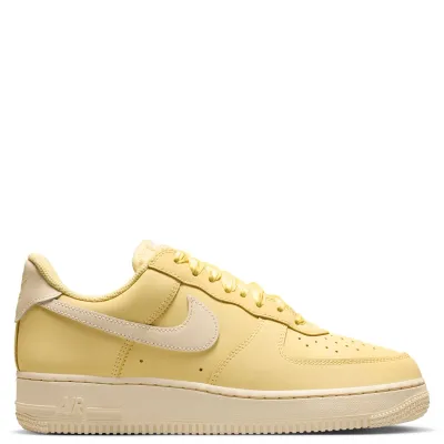 Full lateral side view of Nike Air Force 1 Retro Premium sneakers with cream Swoosh