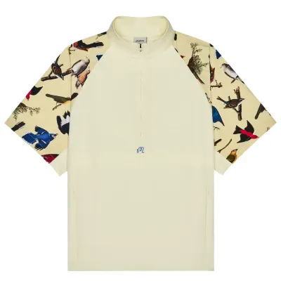 Front product view of Malbon Blue Jay Windshirt with half zip, mock neck, and printed sleeves