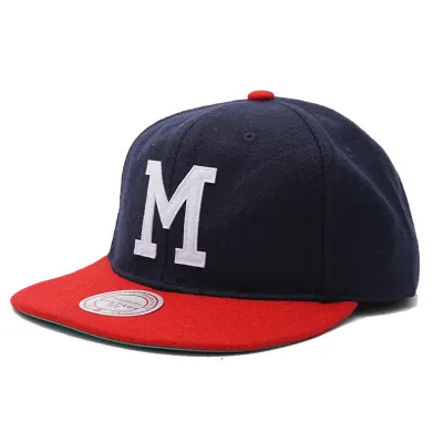 Mitchell &amp; Ness Milwaukee Braves Vintage Ground strapback hat in navy and red with white felt M logo front view.