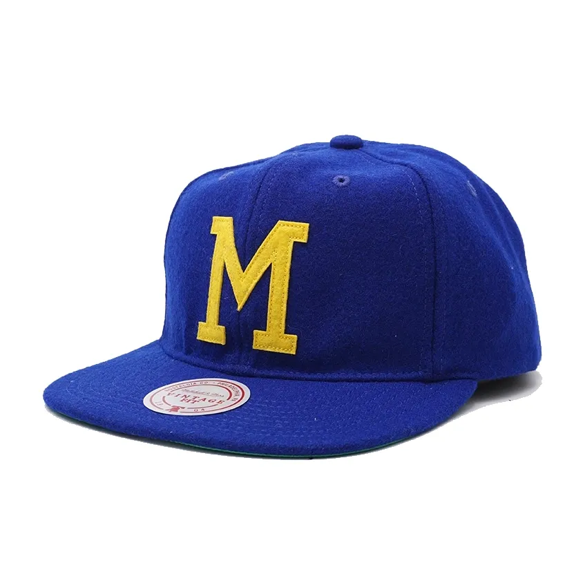 Mitchell &amp; Ness Milwaukee Brewers Vintage Ground strapback hat in dark blue with yellow felt M logo front view.