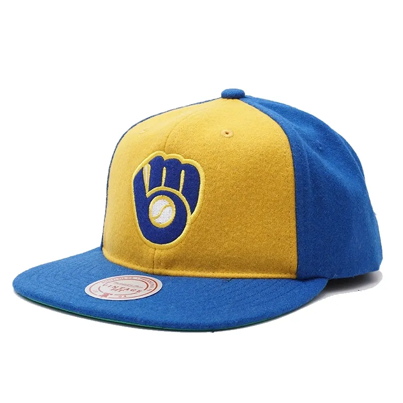 Mitchell &amp; Ness Milwaukee Brewers Vintage Ground strapback hat in royal and gold with embroidered glove logo front view.