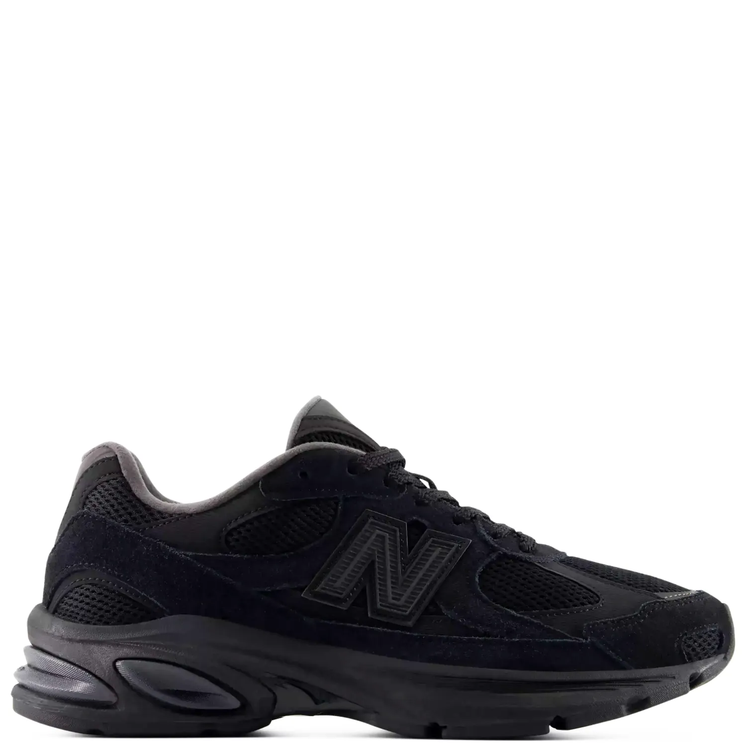 Lateral side view of the New Balance 2010 in Black/Black featuring suede overlays and a segmented ABZORB sole.