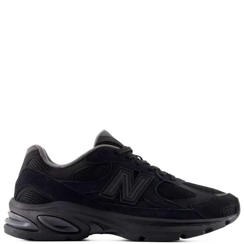 Lateral side view of the New Balance 2010 in Black/Black featuring suede overlays and a segmented ABZORB sole.
