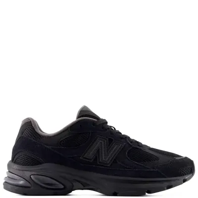Lateral side view of the New Balance 2010 in Black/Black featuring suede overlays and a segmented ABZORB sole.