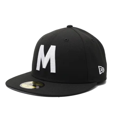 Angled front view of New Era Milwaukee Bears 59FIFTY fitted hat in black with white embroidered M logo