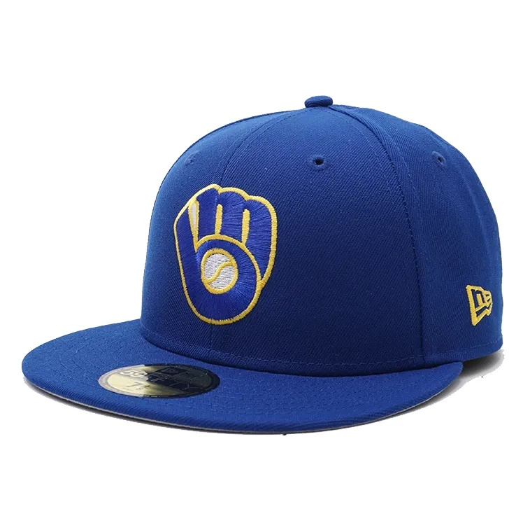 Angled front view of royal Brewers fitted cap with retro ball and glove logo embroidery