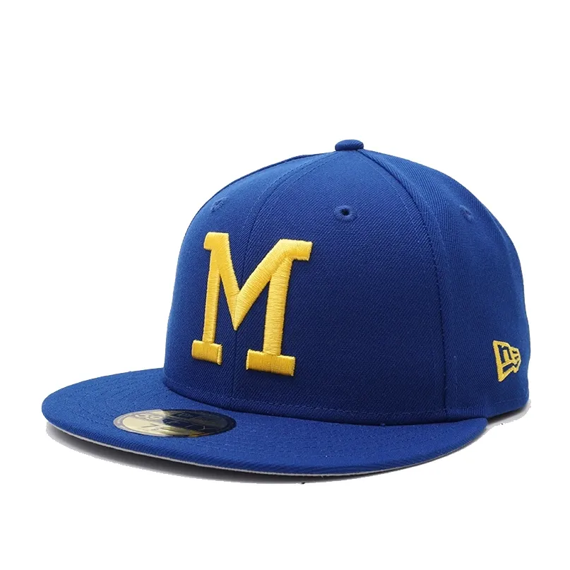 New Era Milwaukee Brewers 70’s M 59FIFTY fitted hat in royal blue and gold angled front view