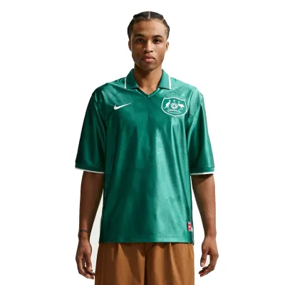 Front view of model wearing Nike Australia Energy soccer jersey with Australia crest and Nike Swoosh.