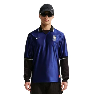 Front view of model wearing Nike Korea Energy soccer jersey with Korea crest and Nike Swoosh.