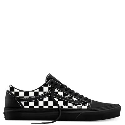 Medial side view of Vans Old Skool Checkerboard with suede overlays and vulcanized sole.