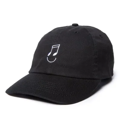 The Quiet Life Music Man Dad Hat in black with embroidered music note smiley graphic.