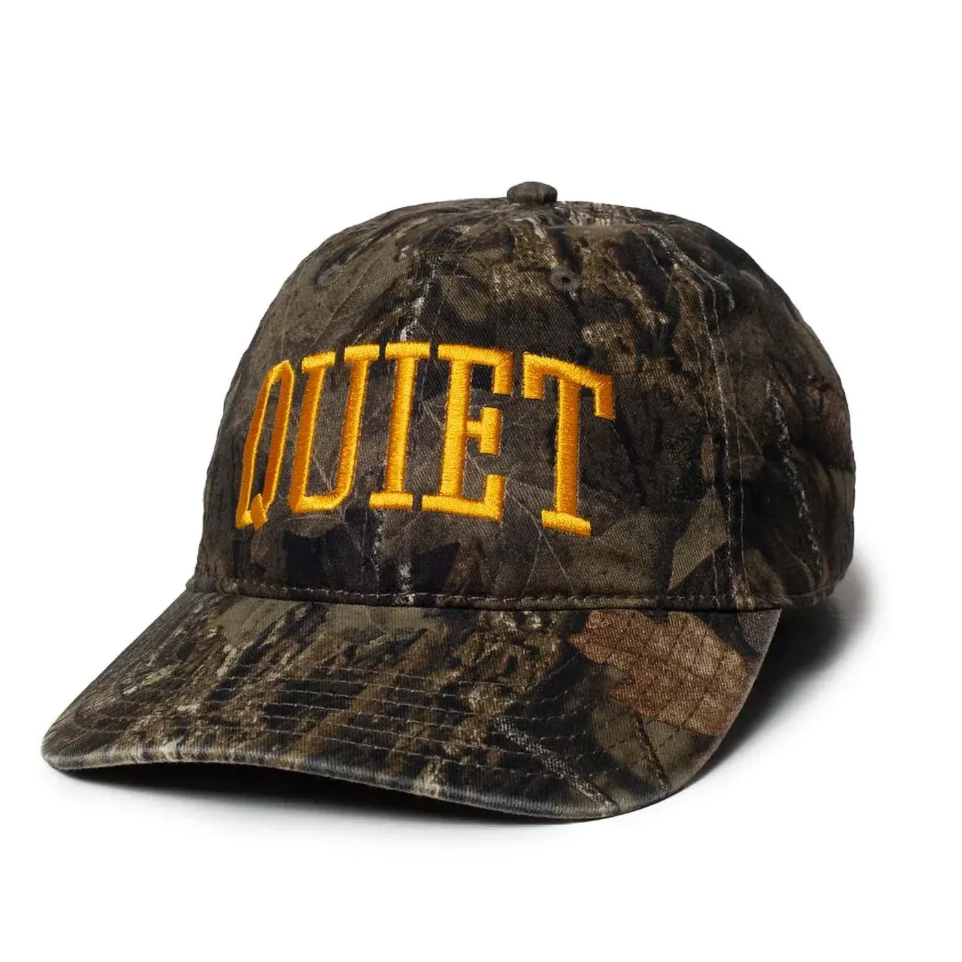 Angled front view of camo six-panel hat with large embroidered QUIET lettering.