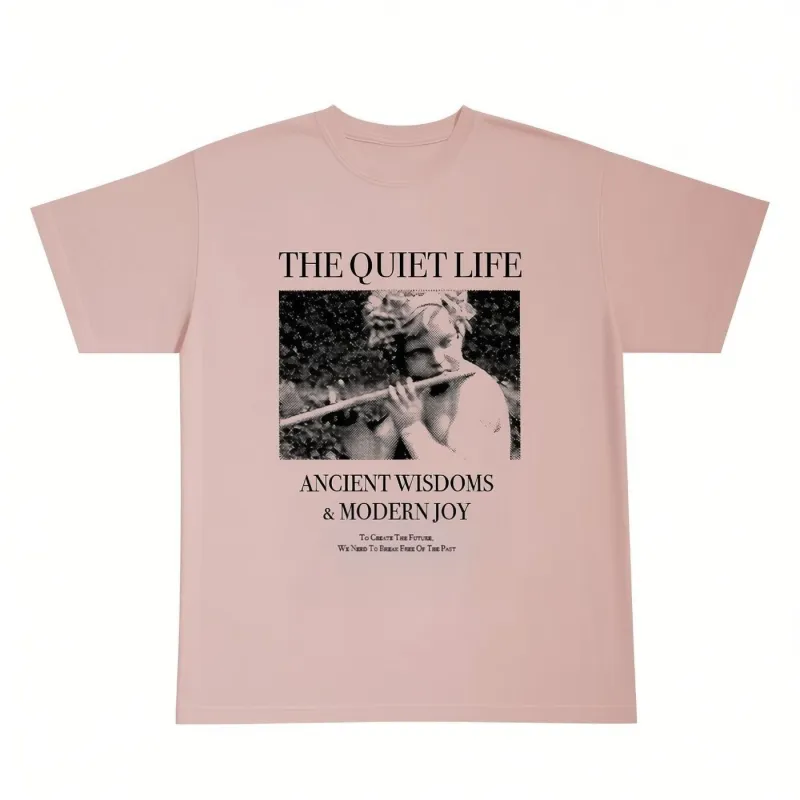 The Quiet Life Ancient Wisdom Modern Joy T-shirt in peach with large front graphic and text artwork.