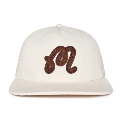 Front view of Malbon Golf Velasco Snapback Hat in cream with brown leather appliqué embroidered logo.