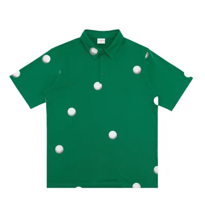 Front view of the Students Golf Filhurst Polo Shirt in Green with scattered golf ball graphics.
