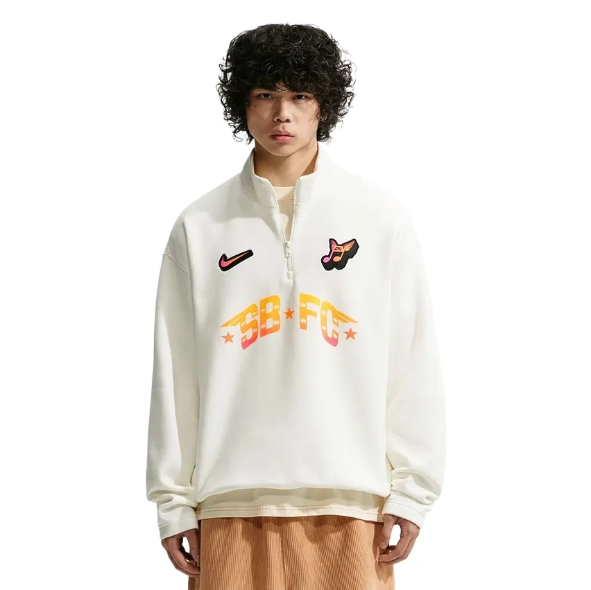 Front view of the Nike SB FC Half Zip Crewneck Sweatshirt in Sail with colorful SB FC graphics.