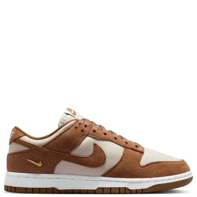 Medial side profile of Nike Women's Dunk Low Suede with premium suede overlays