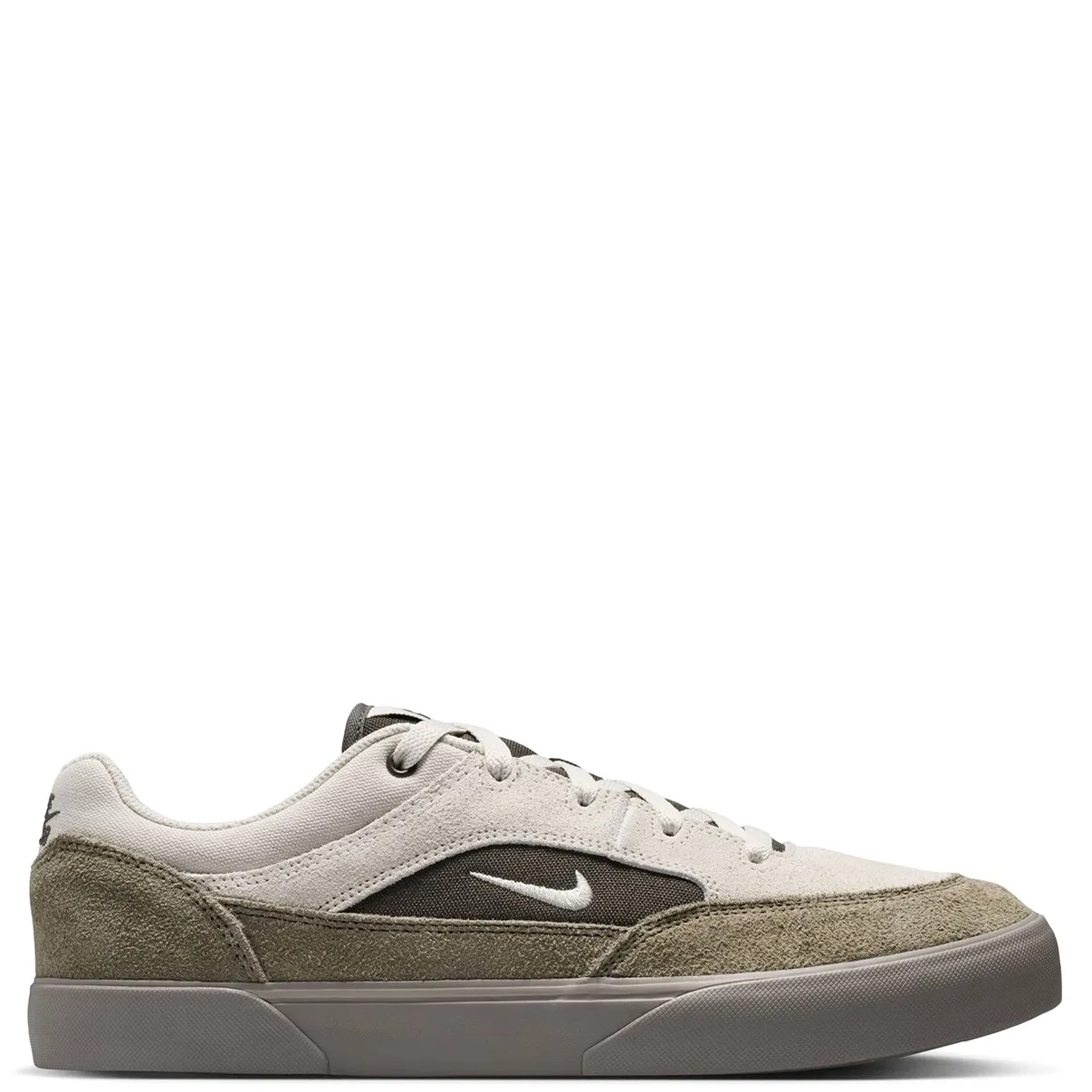 Medial side profile of Nike SB Malor featuring layered suede and canvas construction