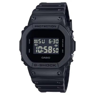 Angled front view of the all-black G-Shock DW5600UBB-1 with a square case and reverse digital display.