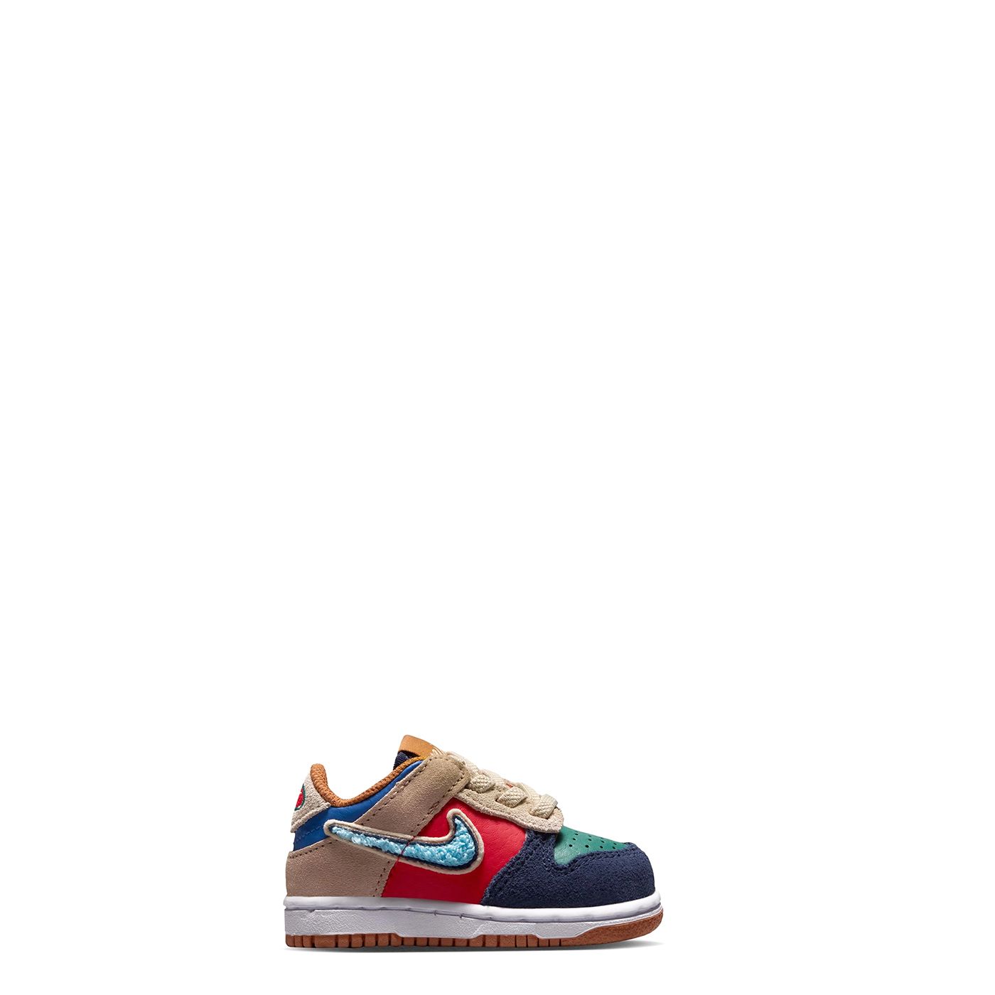 Medial side profile of Nike Dunk Low TD with colorful leather panels and textured chenille Swoosh.