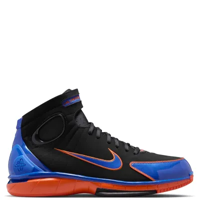 Lateral side view of the Penny Huarache 2K4 with a blue Swoosh outlined in Safety Orange.