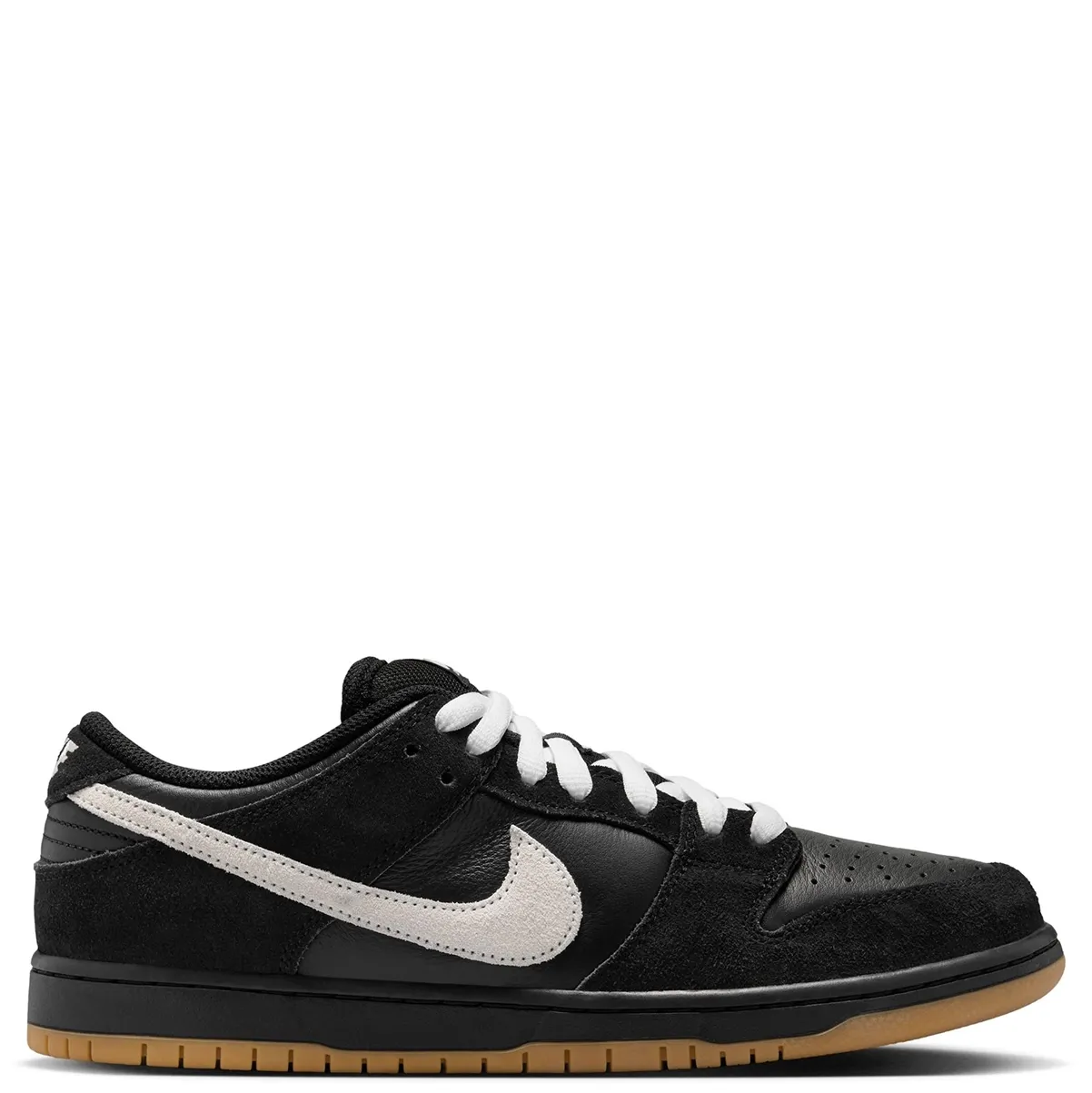 Medial side profile of Nike SB Dunk Low Pro featuring premium black suede overlays and gum rubber outsole.