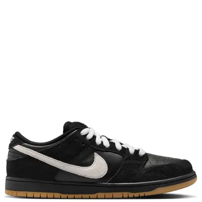 Medial side profile of Nike SB Dunk Low Pro featuring premium black suede overlays and gum rubber outsole.