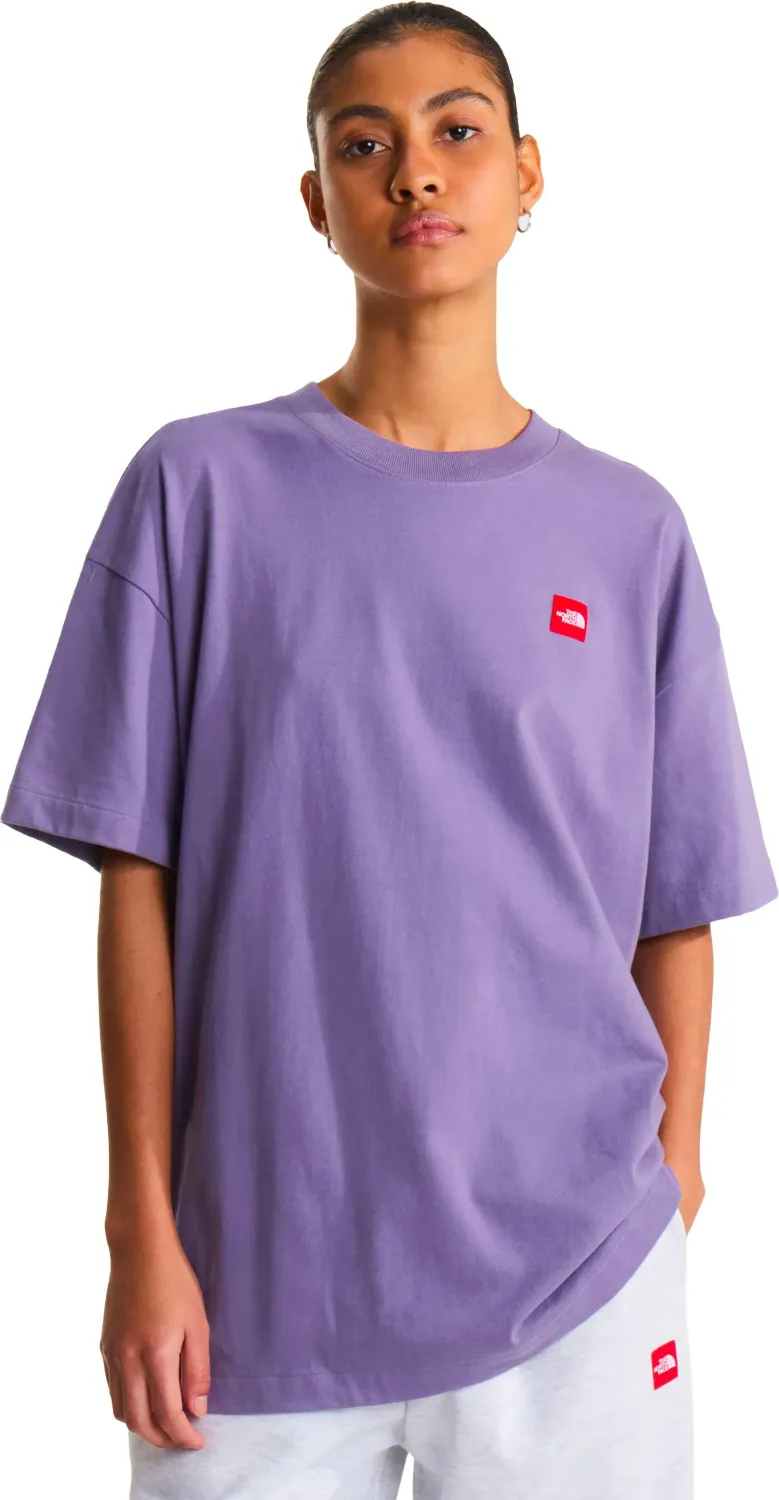 Model wearing The North Face Red Box Tee in Grounded Plum with oversized sleeves and red box chest logo patch.