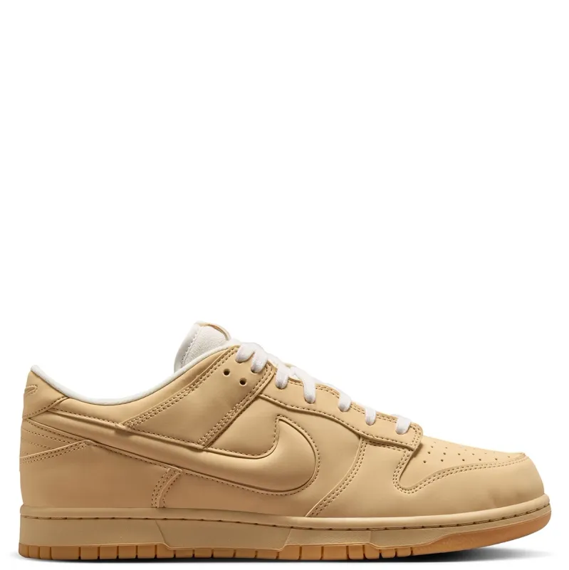 Medial side profile of Nike Dunk Low Retro Premium featuring premium synthetic leather construction.