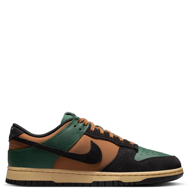 Lateral side profile of Nike Dunk Low Retro in Fir, Black, Light British Tan, and Sesame.