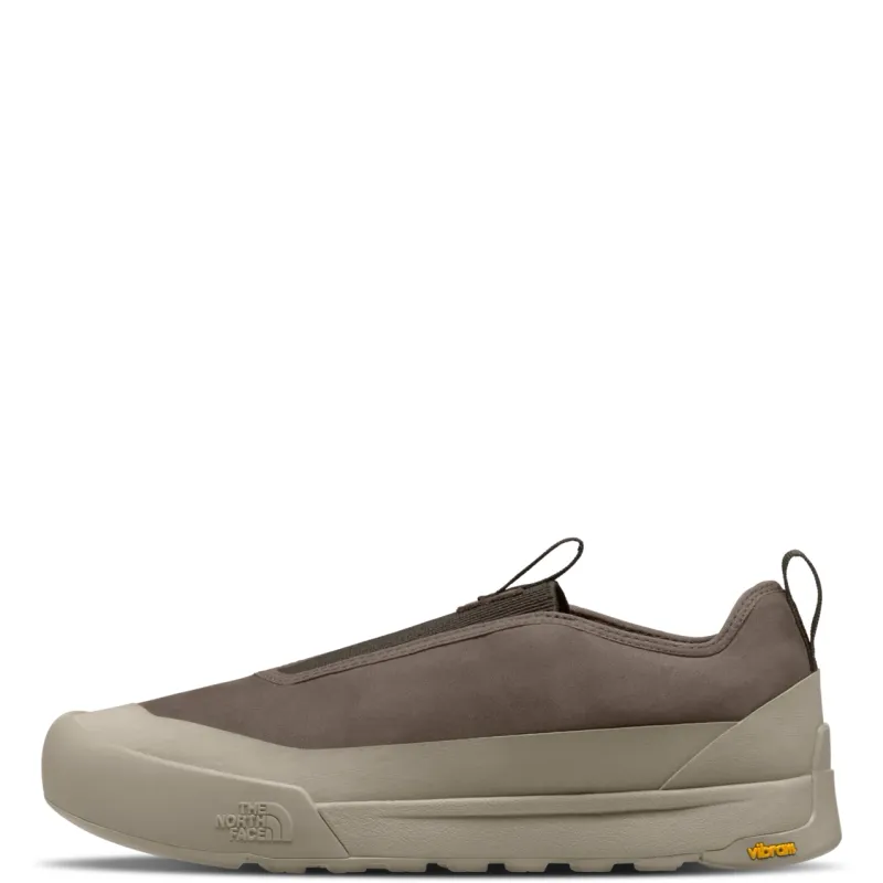 Side view of The North Face Clyffe Slip-On showing nubuck leather, protective taupe rand and Vibram outsole.