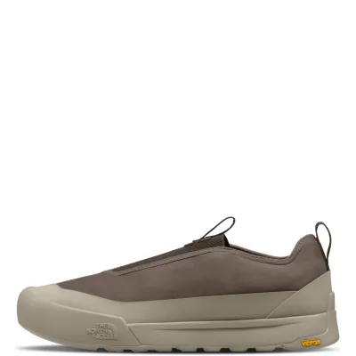 Side view of The North Face Clyffe Slip-On showing nubuck leather, protective taupe rand and Vibram outsole.