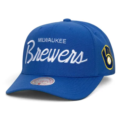 Mitchell &amp; Ness Milwaukee Brewers Head Coach Pro Crown snapback hat in royal blue with embroidered Brewers script.