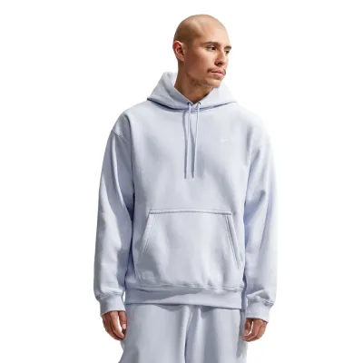 Front view of a model wearing the Football Grey Nike Solo Swoosh hoodie with matching pants and kangaroo pocket.