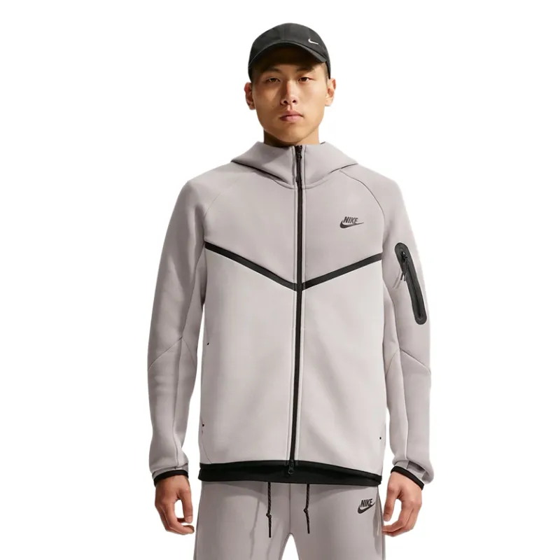 Front view of the Nike Tech Fleece Windrunner showing its full zipper, contrast trim and sleeve pocket.
