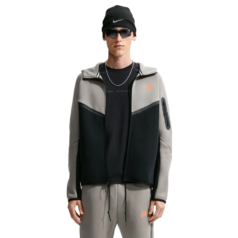 Front view of the open Nike Tech Fleece Windrunner showing Light Army panels, black body and sleeve pocket.