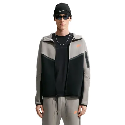 Front view of the open Nike Tech Fleece Windrunner showing Light Army panels, black body and sleeve pocket.