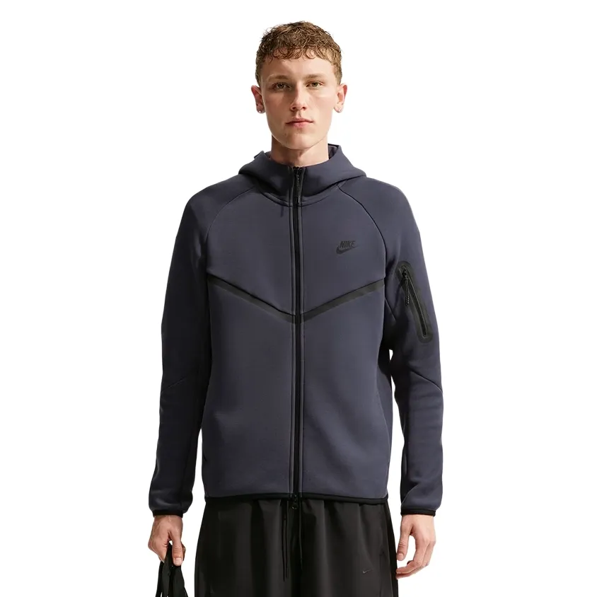 Front view of the Gridiron and Black Nike Tech Windrunner showing the full zipper and sleeve pocket.