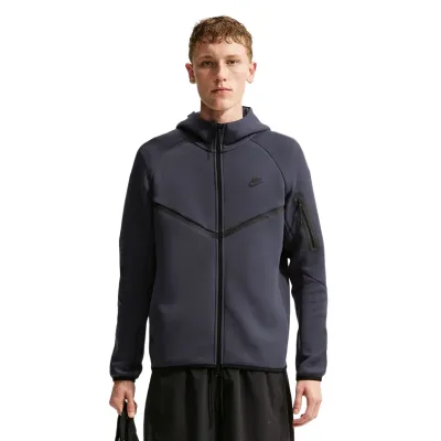 Front view of the Gridiron and Black Nike Tech Windrunner showing the full zipper and sleeve pocket.