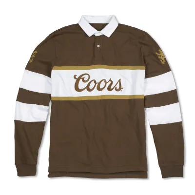 Brown American Needle Coors rugby polo with white collar, striped sleeves and embroidered Coors chest logo.