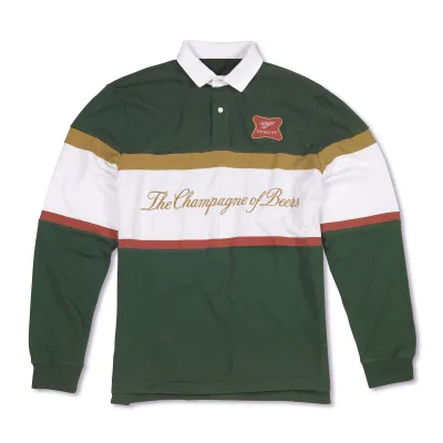 Dark green Miller High Life rugby polo with white collar, multicolor stripes, logo patch and embroidered slogan.