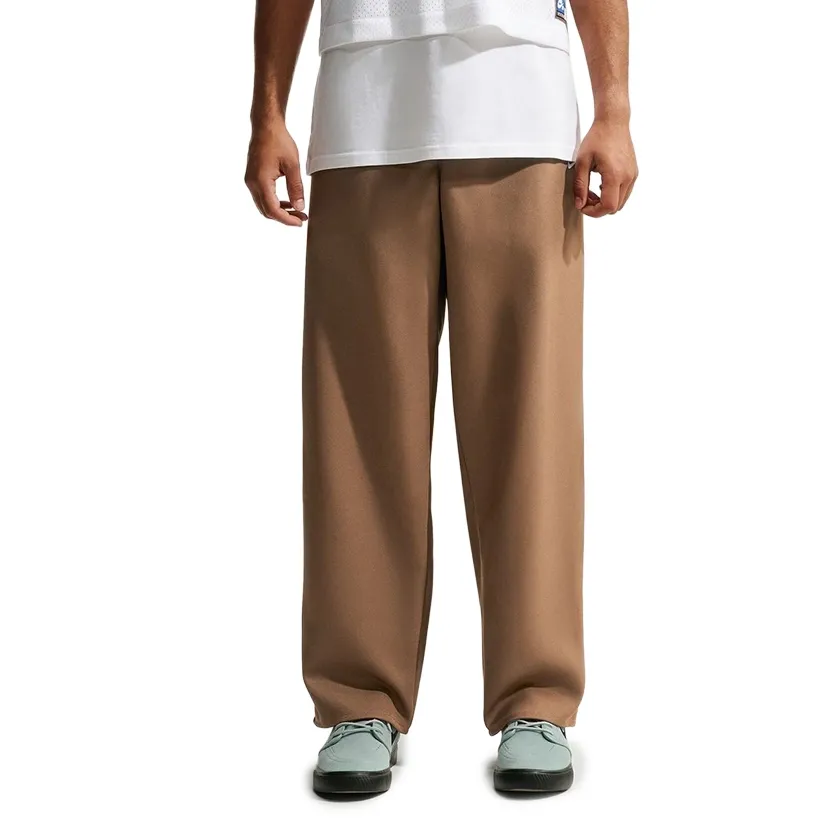 Front view of Nike SB Albatross pants in Mosswood Brown showing the relaxed silhouette and straight legs.