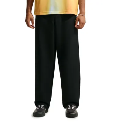 Front view of black Nike SB Albatross Pants showing the relaxed wide-leg silhouette and clean slacks-inspired design.