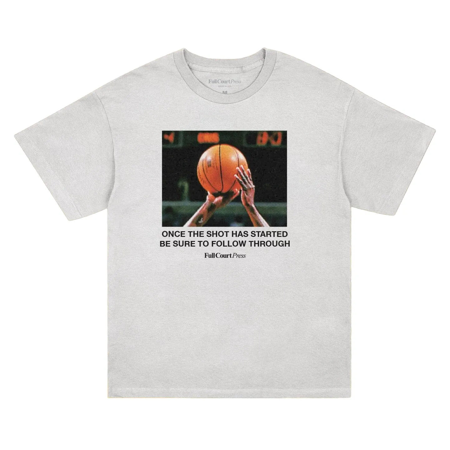 White Full Court Press Follow Through tee with a basketball shooting photo and bold instructional text on the front.