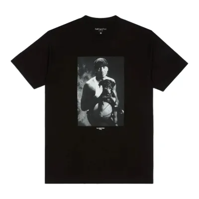 Black Full Court Press Anthony tee with a monochrome portrait of young Carmelo Anthony holding a puppy over a basketball.