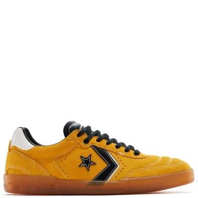 Side view of Converse Louie Lopez Pro 2 yellow suede shoe with black Star Chevron branding and gum sole.