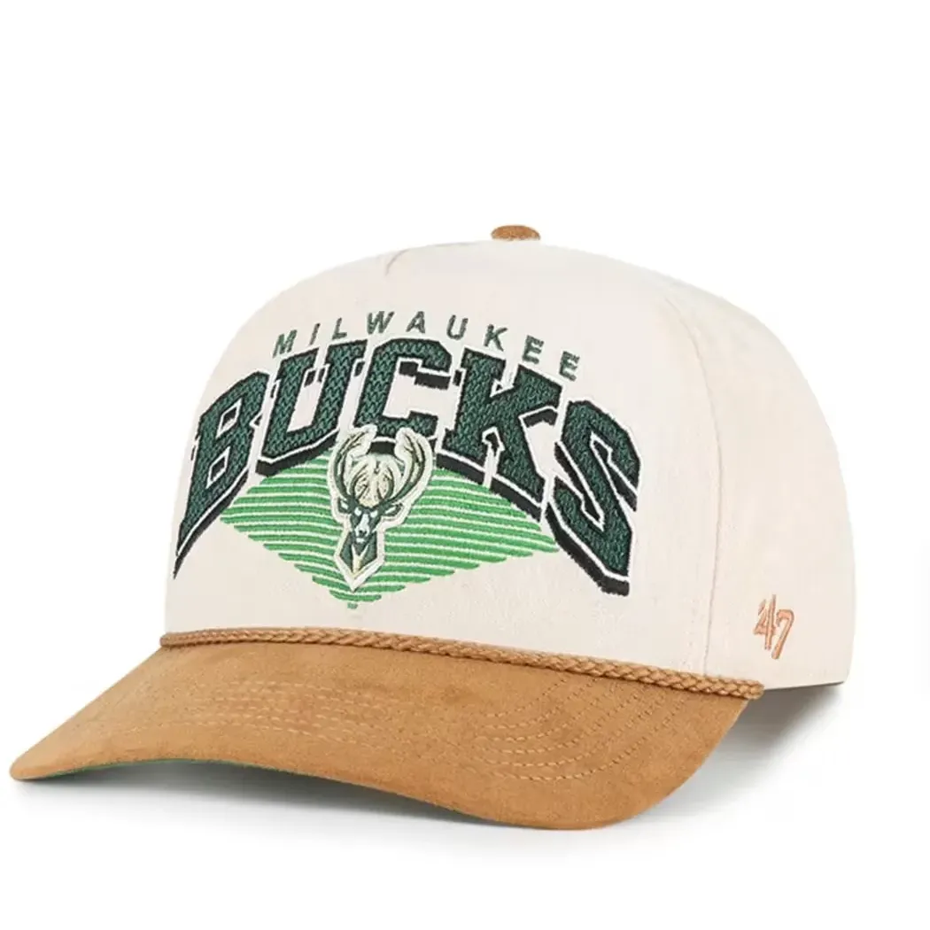 Angled front view of natural ’47 Bucks hat with green team embroidery, tan suede visor and rope detail.