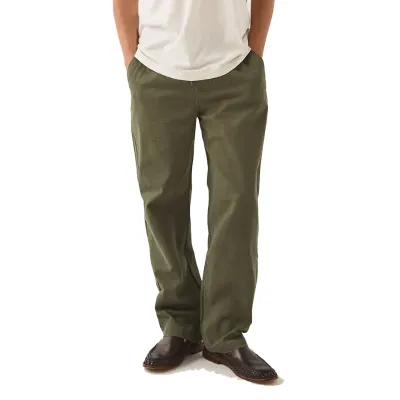 Model wearing Dark Olive Brixton Everyday E-Waist Pants with a relaxed straight-leg silhouette and brown shoes.
