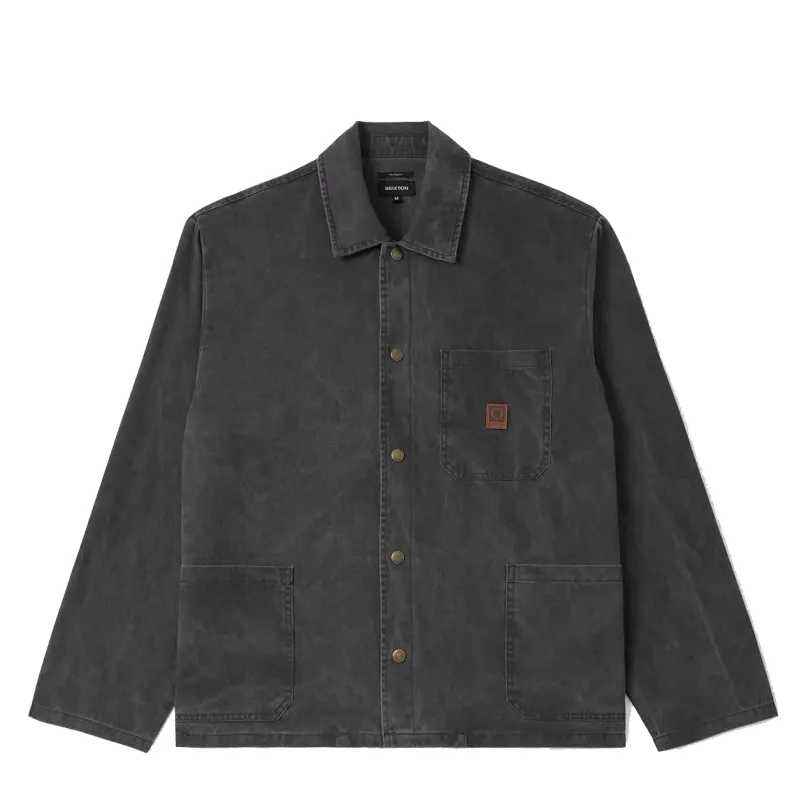 Front view of the Washed Black Brixton Painters Jacket with brass snaps, three patch pockets and a Beta patch.