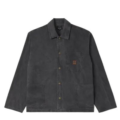 Front view of the Washed Black Brixton Painters Jacket with brass snaps, three patch pockets and a Beta patch.